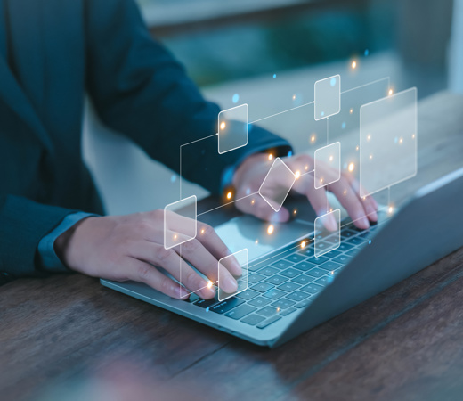 A man working at his desk with his computer